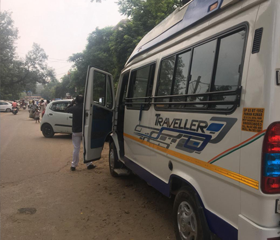 12 seater 2x1 tempo traveller with sofa cum bed